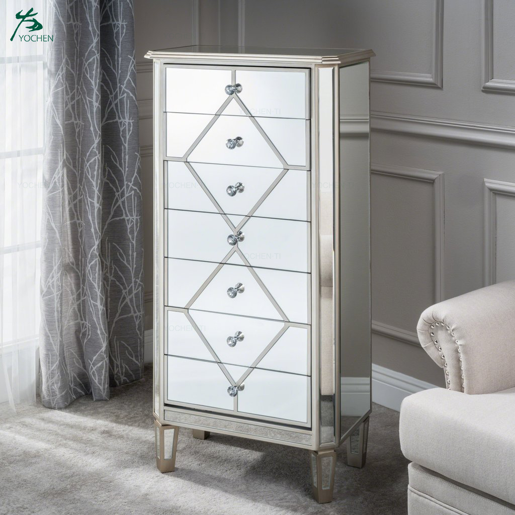 Silver finished mirrored 5 drawer cabinet with faux wood frame